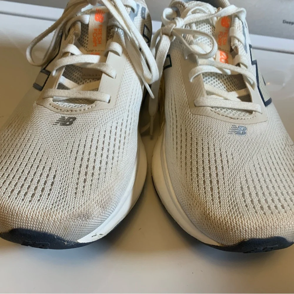 New Balance womens Neutral Running Shoes - Cream with Orange Accents